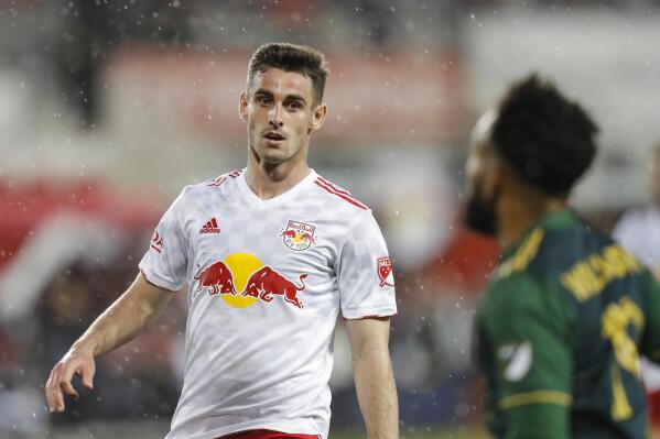 New York Red Bulls defender Dylan Nealis, left, looks at Portland Timbers midfielder Eryk Williamson, right, during the first half of an MLS soccer match, Saturday, May 7, 2022, in Harrison, N.J. (AP Photo/Eduardo Munoz Alvarez)