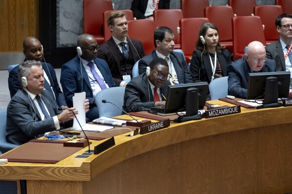 Ukrainian Ambassador to the United Nations Sergiy Kyslytsya, left, shuffles papers as he listens to Vassily Nebenzia, Permanent Representative of Russia to the United Nations, during a meeting of the U.N. Security Council as the war in Ukraine and recent attacks by Russia were discussed Monday, Oct. 9, 2023, at United Nations headquarters. (AP Photo/Craig Ruttle)