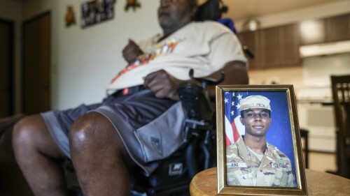 A portrait of American soldier Travis King is displayed as his grandfather, Carl Gates, talks about his grandson Wednesday, July 19, 2023, in Kenosha, Wis. Pvt. King bolted into North Korea while on a tour of the Demilitarized Zone on Tuesday, July 18, a day after he was supposed to travel to a base in the U.S. (AP Photo/Morry Gash)