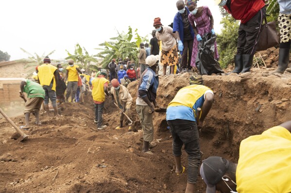Remains of victims are retrieved from a site, in Huye District, southern Rwanda Tuesday, Jan. 23, 2024. A Rwandan official says the remains of 119 people believed to be victims of genocide have been discovered in the country’s south, as authorities continue to find mass graves nearly three decades after the killings. In April, Rwanda will commemorate the 30th anniversary of the genocide, in which an estimated 800,000 Tutsi and moderate Hutu were killed by Hutu extremists. (AP Photo)