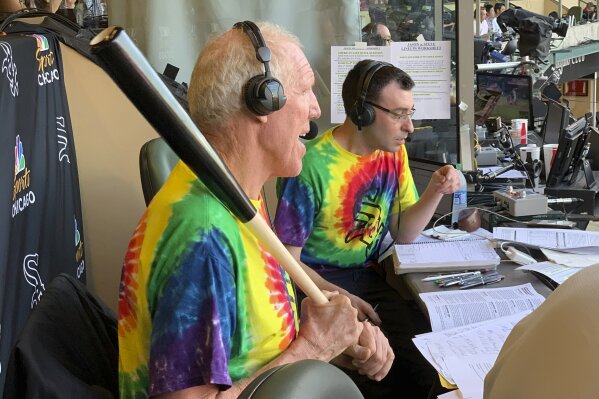Bill Walton does commentary on NBC Sports Chicago for the Chicago White Sox's baseball game against the Los Angeles Angels on Friday, Aug. 16, 2019, in Anaheim, Calif. Walton was calling the game on an invitation from the White Sox and announcer Jason Benetti, right. (AP Photo/Joe Reedy)