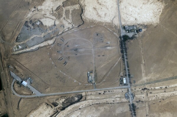 A missile defense site near an international airport and air base is seen in Isfahan, Iran, Monday, April 22, 2024. Satellite photos taken Monday suggest an apparent Israeli retaliatory strike targeting Iran's central city of Isfahan hit a radar system for a Russian-made air defense battery, contradicting repeated denials by officials in Tehran in the time since the assault. (Planet Labs PBC via AP)