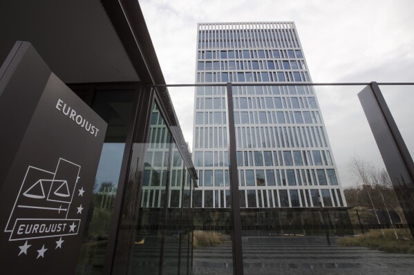FILE - Exterior view of the Eurojust building prior to a press conference in The Hague, Netherlands, Wednesday, Dec. 5, 2018. Police coordinated by the European Union's justice and police agencies have taken down computer networks responsible for spreading ransomware via infected emails, in what they called the biggest-ever international operation against the lucrative form of cybercrime. (AP Photo/Peter Dejong, File)