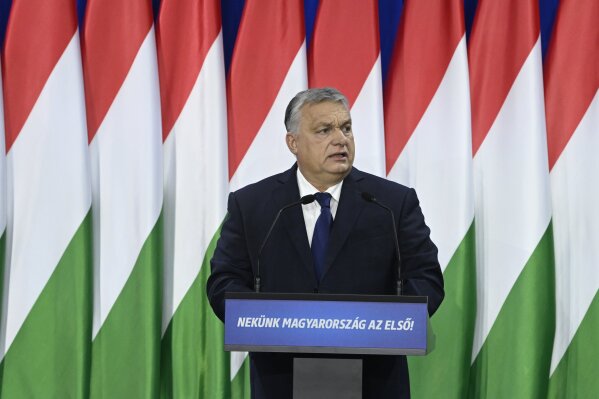 Hungary's Prime Minister Viktor Orban delivers his annual "State of Hungary" speech in Budapest, Hungary, Saturday, Feb. 17, 2024. The message on lectern reads: "For us Hungary is the first!" (Szilard Koszticsak/MTI via AP)