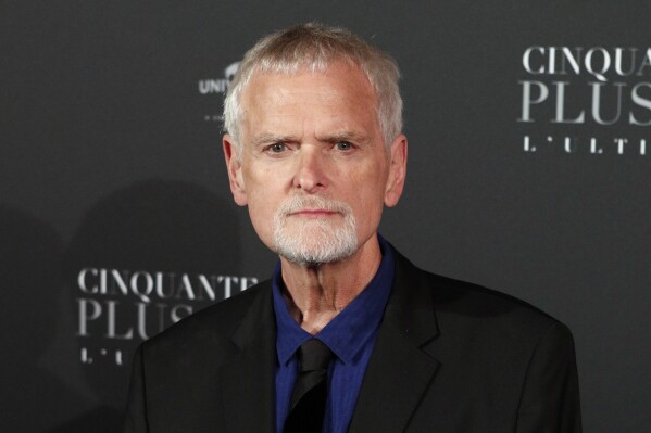 Director James Foley poses during a photocall for the world premiere of "Fifty Shades Freed" in Paris on Feb. 6, 2018. (AP Photo/Francois Mori, File)