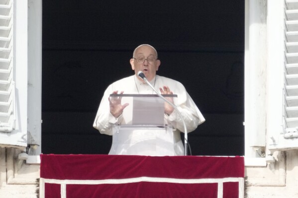 Pope Francis delivers the Angelus noon prayer from his studio's window overlooking St.Peter's Square, at the Vatican, Sunday, Jan. 14, 2024. (AP Photo/Gregorio Borgia)