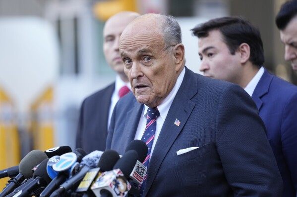 Former New York Mayor Rudy Giuliani speaks to the media as he leaves court in New York, Thursday, Nov. 7, 2024. (AP Photo/Seth Wenig)