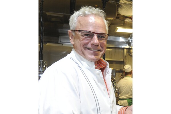 Chef David Bouley appears at a promotional event for 2014 Georges Duboeuf Beaujolais Nouveau at Bouley in New York on Nov. 19, 2014. Bouley, the award-winning and frenetic chef whose idiosyncratic haute cuisine and crusty breads pleased critics and the public during a career chasing sleek deliciousness, died of a heart attack Monday at his home in Kent, Connecticut, according to Lisa Queen, his literary agent. He was 70. (Photo by Diane Bondareff/Invision for Les Vins Georges Duboeuf via AP)