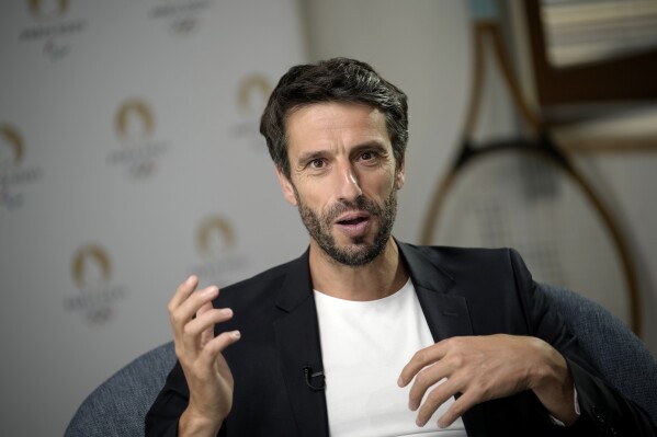 Paris 2024 Olympics Organizing Committee President Tony Estanguet gestures during an interview with the Associated Press at the headquarters of the Paris Olympic organizers in Saint-Denis, outside Paris, France, Tuesday, June 27, 2023. (AP Photo/Christophe Ena)