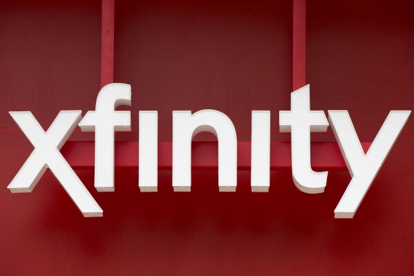 FILE - Signage for Xfinity, the cable division of Comcast, is displayed in Philadelphia, July 15, 2015. Hackers accessed Xfinity customers’ personal information by exploiting a vulnerability in software used by the company, the Comcast-owned telecommunications business announced this week. In a Monday, Dec. 18, 2023, notice to customers, Xfinity said there was unauthorized access to internal systems as a result of this vulnerability — which was previously announced by software provider Citrix — between Oct. 16 and 19. (AP Photo/Matt Rourke, File)