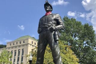 A statue of a coal miner is shown Thursday, Aug. 26, 2021, at the West Virginia Capitol in Charleston, W.Va. This weekend, marchers are retracing the steps of thousands of coal miners who participated in the Battle of Blair Mountain in southern West Virginia. At least 16 men died in the largest U.S. armed uprising since the Civil War before the miners surrendered to federal troops in early September 1921. (AP Photo/John Raby)