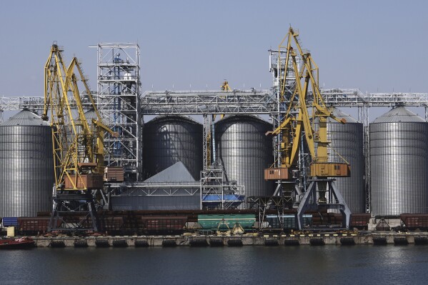 FILE - Exterior view of the grain storage terminal during visit of United Nations Secretary General Antonio Guterres at the Odesa Sea Port, in Odesa, Ukraine, Aug. 19, 2022. Two cargo ships have arrived in one of Ukraine’s ports Saturday, using a temporary Black Sea corridor established by the government. They're the first since Russia’s withdrawal from a wartime agreement designed to ensure safe grain exports from the invaded country’s ports (AP Photo/Kostiantyn Liberov, File)