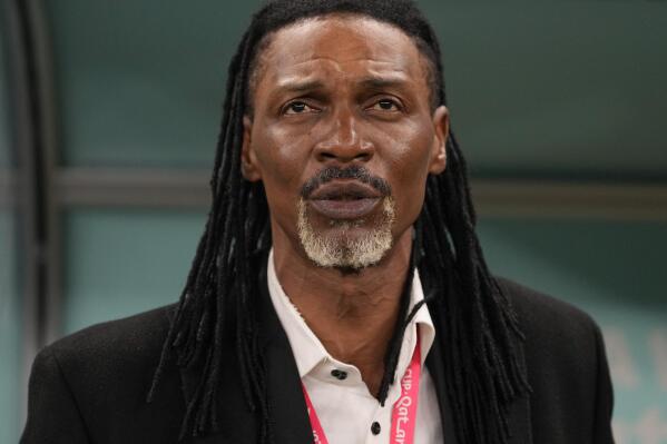 Cameroon's head coach Rigobert Song listen to national anthem prior the World Cup group G soccer match between Cameroon and Brazil, at the Lusail Stadium in Lusail, Qatar, Friday, Dec. 2, 2022. (AP Photo/Andre Penner)