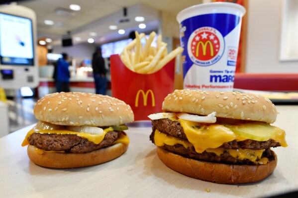 FILE- A McDonald's Quarter Pounder, left, and Double Quarter Pound burger is shown with fresh beef in Atlanta, March 6, 2018. A top European Union court ruled that McDonald’s has lost its Big Mac trademark in the 27-nation bloc, ruling in favor of Irish fast food rival Supermac’s in a longrunning legal battle. The EU General Court’s ruling said in its judgement Wednesday, June 5, 2024, that the U.S. fast food giant failed to prove that it was genuinely using the Big Mac name over a five-year period for chicken sandwiches, poultry products or restaurants. (AP Photo/Mike Stewart, File)
