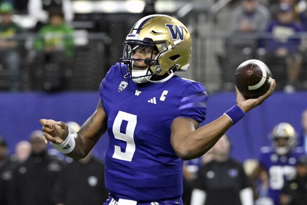 FILE - Washington quarterback Michael Penix Jr. looks to pass against Oregon during the first half of the Pac-12 championship NCAA college football game Friday, Dec. 1, 2023, in Las Vegas. The final four-team College Football Playoff promises to be one of the closest in the 10-year history of the event(AP Photo/David Becker, File)