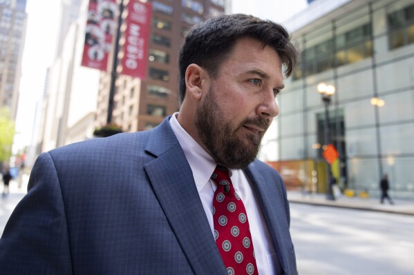 Richard Globensky, of Augusta, Ga., walks out of the Dirksen U.S. Courthouse, Wednesday, May 15, 2024, in Chicago. Globensky, a former warehouse assistant for the Augusta National Golf Club in Georgia, pleaded guilty Wednesday to transporting millions of dollars worth of stolen Masters tournament memorabilia and historic items including a green jacket belonging to Arnold Palmer. (Vincent Alban/Chicago Tribune via AP)