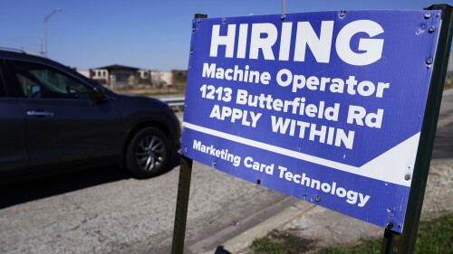 A hiring sign is seen in Downers Grove, Ill., Wednesday, April 12, 2023. On Thursday, the Labor Department reports on the number of people who applied for unemployment benefits last week. (AP Photo/Nam Y. Huh)