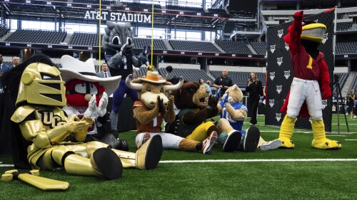 Mascots listen to Big 12 Commissioner Brett Yormack speak at the opening of the NCAA college football Big 12 media days in Arlington, Texas, Wednesday, July 12, 2023. (Sara Diggins/Austin American-Statesman via AP)