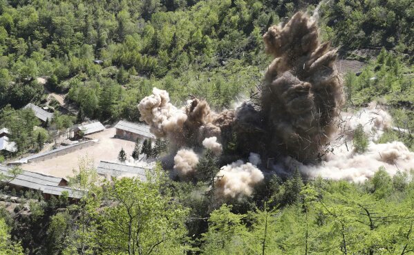
              FILE - In this May 24, 2018, file photo, command post facilities of North Korea's nuclear test site are exploded in Punggye-ri, North Korea. With their second summit fast approaching, speculation is growing that U.S. President Donald Trump may try to persuade North Korean leader Kim Jong Un to commit to denuclearization by giving him something he wants more than almost anything else, an announcement of peace and an end to the Korean War. A combination of that strategy and the North’s repeated tests of missiles believed capable of delivering its nuclear weapons to the U.S. mainland are what brought the two countries to the negotiation table. (Korea Pool/Yonhap via AP, File)
            