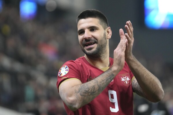 FILE - Serbia's Aleksandar Mitrovic reacts after the Euro 2024 group G qualifying soccer match between Serbia and Bulgaria at the Dubocica stadium in Leskovac, Serbia, Sunday, Nov. 19, 2023. Serbia and Slovenia will be hoping for their own fairytales after qualifying for the Euros for the first time in more than two decades.(AP Photo/Darko Vojinovic, File)