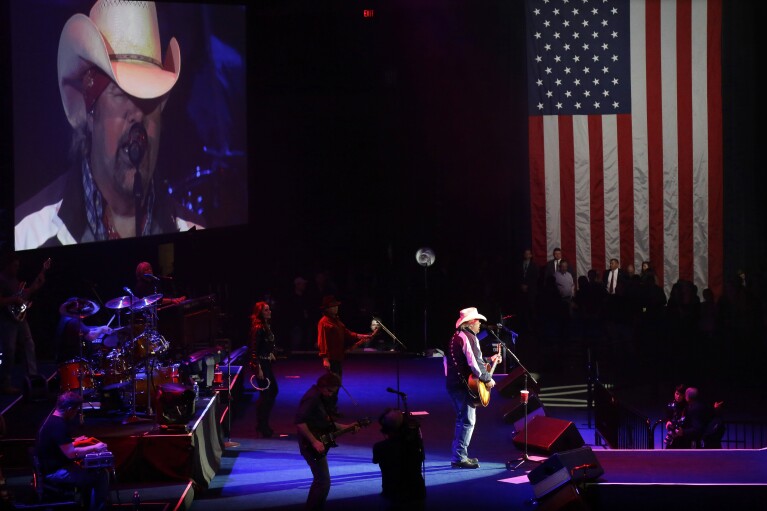 FILE - Toby Keith performs during the inaugural concert for Republican Gov. Bruce Rauner on Monday, Jan. 12, 2015, in Springfield, Ill. Keith, who died of cancer on Monday, Feb. 5, 2024, at age 62, is being celebrated for his immense catalog of songs. But his 2002 track “Courtesy Of The Red, White And Blue (The Angry American)