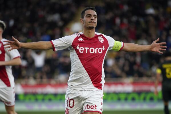 Monaco's Wissam Ben Yedder celebrates scoring his side's 2nd goal during a French League One soccer match between Monaco and Paris Saint-Germain at the Stade Louis II in Monaco, Saturday, Feb. 11, 2023. (AP Photo/Daniel Cole)