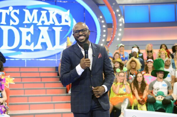 This image released by CBS Entertainment shows Wayne Brady, host of the daytime game show "Let's Make a Deal." The CBS daytime game show that usually has a studio audience in zany costumes is asking front-line workers to submit a video audition for an upcoming special online edition of the show. (Bonnie Osbourne/CBS via AP)