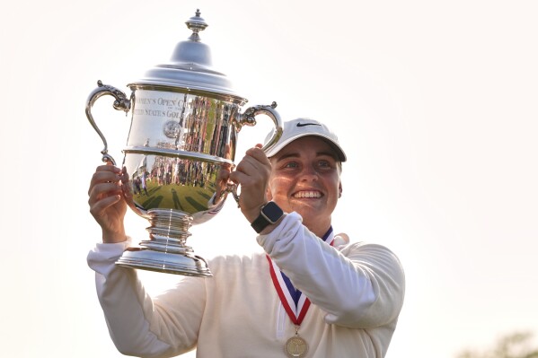 Maja Stark, of Sweden, holds her winning trophy after winning the U.S. Women's Open golf tournament at Erin Hills Sunday, June 1, 2025, in Erin, Wis. (AP Photo/Jeff Roberson)