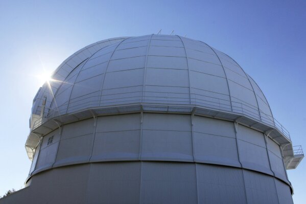 FILE - This Aug. 9, 2014, file photo, shows the dome of the historic Mount Wilson Observatory, which houses the 100-inch (254 cm) Hooker Telescope in the San Gabriel Mountains northeast of Los Angeles. Firefighters burned off vegetation on Tuesday, Sept. 15, 2020, to protect the observatory from a wildfire. (AP Photo/John Antczak, File)