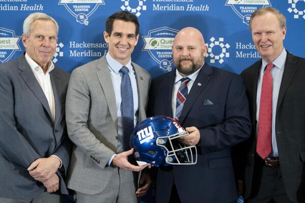 From left, New York Giants chairman and executive vice president Steve Tisch, general manager Joe Schoen,new head coach Brian Daboll, and president John Mara pose for a photograph during a news conference at the NFL football team's training facility, Monday, Jan. 31, 2022, in East Rutherford, N.J. (AP Photo/John Minchillo)