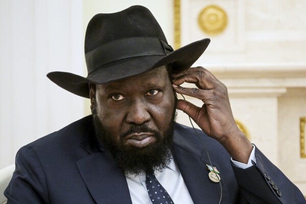 South Sudan President Salva Kiir Mayardit adjusts his earphone as he prepares to listen to Russian President Vladimir Putin during their talks at the Kremlin in Moscow, Russia, Thursday, Sept. 28, 2023. (Vladimir Astapkovich, Sputnik, Kremlin Pool Photo via AP)