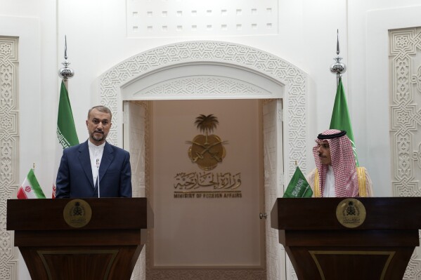 In this picture released by the Iranian Foreign Ministry, Iran's Foreign Minister Hossein Amirabdollahian, left, speaks during a joint news briefing with his Saudi Arabian counterpart Prince Faisal bin Farhan Al Saud in Riyadh, Saudi Arabia, Thursday, Aug. 17, 2023. Iran's foreign minister traveled to Saudi Arabia on Thursday, marking the first trip to the kingdom by Tehran's top diplomat in years after the two nations reached a détente with Chinese mediation. (Iranian Foreign Ministry via AP)