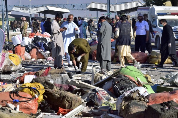 Investigators collect evidences from the site of a bomb explosion at railway station in Quetta, southwestern Pakistan, Saturday, Nov. 9, 2024. (AP Photo/Arshad Butt)