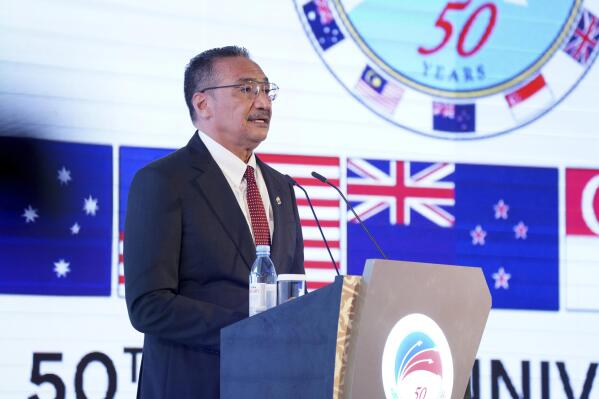 In this photo released by Malaysia Defense Ministry, Malaysian Defense Minister Hishammuddin Hussein speaks during the opening of the Five Power Defense Arrangements (FPDA) meeting in Kuala Lumpur, Malaysia, Thursday, Oct. 21, 2021. Australia and Britain are defending their nuclear submarine deal with the U.S. amid concerns it could escalate tensions in the region and spark an arms race. (Malaysia Defense Ministry via AP)