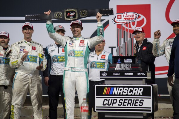 Denny Hamlin celebrates after winning a NASCAR Cup Series auto race at Richmond Raceway on Sunday, March 31, 2024, in Richmond, Va. (AP Photo/Mike Caudill)