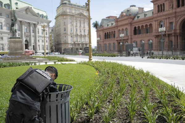 
              An anti explosives police officer inspects a garbage bin in front of the presidential palace in Buenos Aires, Argentina, Thursday, Nov. 29, 2018. Thousands of police and security agents will guard Group of 20 industrialized nations' world leaders during the two-day summit that starts Friday. (AP Photo/Sebastian Pani)
            