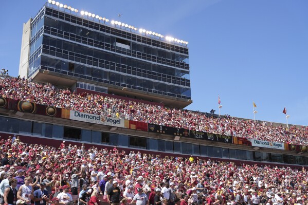 FILE - Fans fill Jack Trice Stadium as Iowa State takes on Northern Iowa during the first half of an NCAA college football game, Saturday, Sept. 2, 2023, in Ames, Iowa. An Iowa criminal investigator suggested to colleagues last year that busting college athletes for online sports betting would impress the public and “the powers that be” and also nudge the state legislature toward updating gambling laws. Five starters on the Iowa State football team and a number of Iowa football and basketball players were among athletes criminally charged or suspended by the NCAA. (AP Photo/Matthew Putney, File)