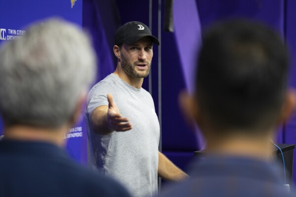 For the first time since tearing his achilles tendon, Minnesota Vikings quarterback Kirk Cousins speaks at an NFL football news conference in Eagan, Minn., Friday, Nov. 17, 2023. (Shari L. Gross/Star Tribune via AP)