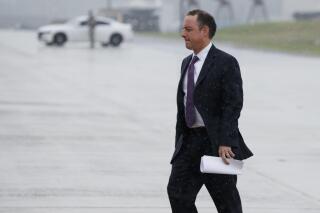FILE - In this July 28, 2017 file photo, then - White House Chief of Staff Reince Priebus walks to boards Air Force One at Andrews Air Force Base, Md. A Republican-ordered investigation into Wisconsin's 2020 election could cost taxpayers at least $680,000, more than nine times the original cost of contracts signed earlier this summer, according to Reince Priebus, the former state and national head of the Republican Party. (AP Photo/Evan Vucci File)