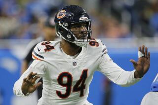 Quinn says he's on board as rebuilding Bears begin practices