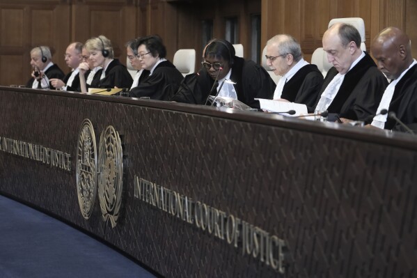 FILE - Judge Nawaf Salam, third right, speaks at the start of a two days hearing at the World Court in The Hague, Netherlands, Monday, April 8, 2024, in a case brought by Nicaragua accusing Germany of breaching the genocide convention by providing arms and support to Israel. The United Nations’ top court is set to rule on a request by Nicaragua for judges to order Germany to halt military aid to Israel. (AP Photo/Patrick Post, File)