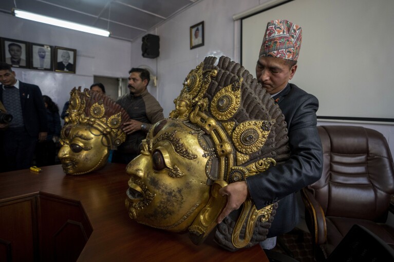 Masks of Hindu deity Lord Bhairabh dated from 16th century, stolen from Nepal's Dolakha district and brought back from Dallas museum of art and Rubin Museum of art are displayed during a press conference at the Department of Archaeology in Kathmandu, Nepal, Jan. 31, 2024. An unknown number of sacred statues of Hindu deities were stolen and smuggled abroad in the past. Now dozens are being repatriated to the Himalayan nation, part of a growing global effort to return such items to countries in Asia, Africa and elsewhere. (AP Photo/Niranjan Shrestha)