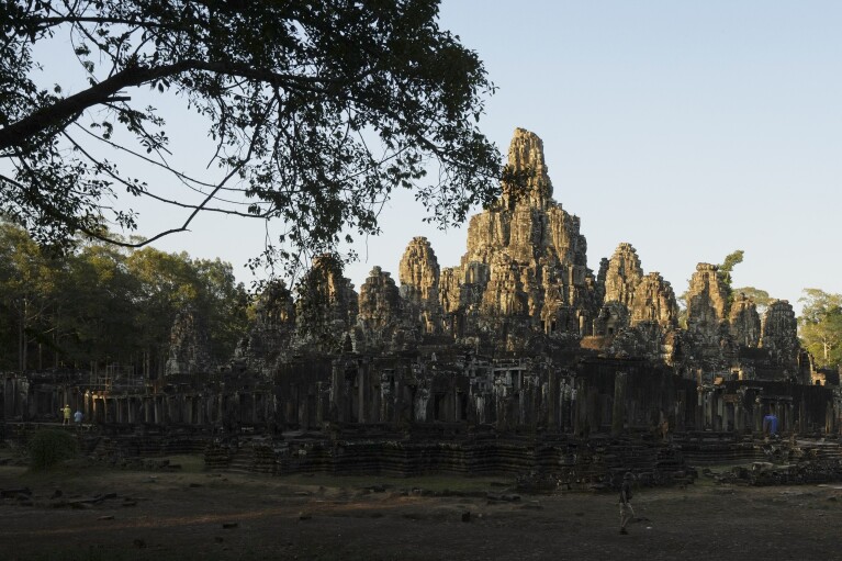 Tourists visit Bayon temple at Angkor Wat temple complex in Siem Reap province, Cambodia, Wednesday, April 3, 2024.  (AP Photo/Heng Sinith)