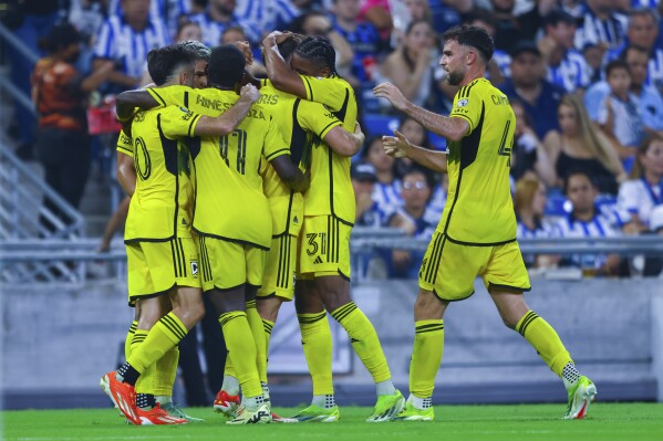 United States' Columbus Crew players congratulate teammate Aidan Morris after scoring a goal against Monterrey, during a CONCACAF Champions Cup semifinal second leg soccer match at the BBVA stadium in Monterrey, Mexico, Wednesday, May 1, 2024. (AP Photo/Alberto Lopez)