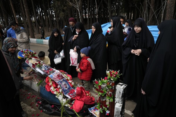 People visit the scene of Wednesday's bombing in the city of Kerman, about 820 km (about 510 miles) southeast of Tehran, Iran, on Thursday, Jan. 4, 2024.  Investigators believe the suicide bombers may have attacked a memorial to an Iranian general.  The 2020 U.S. was killed in a drone strike, state media reported Thursday, as Iran grapples with its biggest mass-casualty attack in decades and the broader Mideast remains on edge.  (AP Photo/Vahid Salemi)