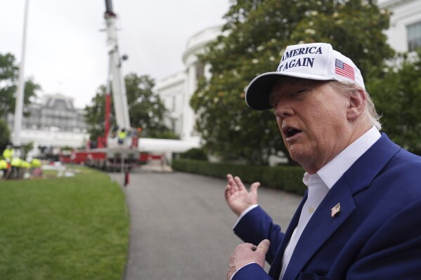 President Donald Trump speaks as a flag pole is installed on the South Lawn of the White House, Wednesday, June 18, 2025, in Washington. (AP Photo/Evan Vucci)