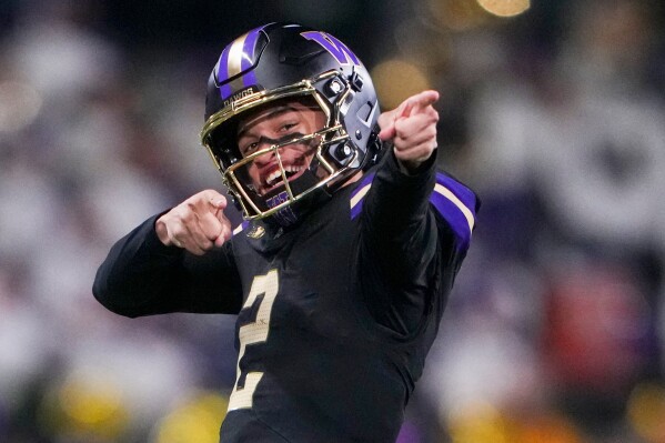 Washington quarterback Demond Williams Jr. (2) reacts after a run against UCLA during the second half of an NCAA college football game Friday, Nov. 15, 2024, in Seattle. (AP Photo/Lindsey Wasson, File)