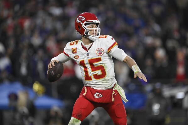FILE - Kansas City Chiefs quarterback Patrick Mahomes (15) throws a pass during the second half of the AFC Championship NFL football game against the Baltimore Ravens, in Baltimore, Sunday, Jan. 28, 2024. The NFL announced Monday, May 13, that the Super Bowl champion Kansas City Chiefs will open the season at home against the Baltimore Ravens on Thursday, Sept. 5. The game is a rematch of the AFC championship game in January, which the Chiefs won 17-10 in Baltimore. (Ǻ Photo/Terrance Williams, File)