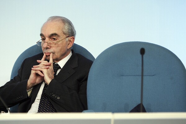 FILE - Italian Interior Minister Giuliano Amato looks on next to an empty seat, during a press conference after a cabinet meeting in Rome's Palazzo Chigi premier's office, Friday March 16, 2007. A former Italian premier is contending that a French air force missile brought down a passenger jet over the Mediterranean Sea in 1980 and is appealing to France's president to respond. The crash of the Italian domestic airliner killed all 81 persons aboard. What caused the crash is an enduring mystery. (AP Photo/Plinio Lepri, File)