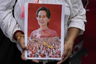 FILE - A supporter shows a portrait of former leader Aung San Suu Kyi during a protest marking the two-year anniversary of the military takeover that ousted her government outside the Myanmar Embassy in Bangkok, Thailand, on Feb. 1, 2023. A legal official in Myanmar say the country's highest court has agreed to hear appeals from the lawyers of the country’s ousted leader Aung San Suu Kyi concerning her convictions for corruption, election fraud and the country’s official secrets act. Suu Kyi, 77, who was detained on Feb. 1, 2021 when the military seized power from her elected government, is serving prison sentences totaling 33 years after being convicted in a series of politically driven prosecutions brought by the military. (AP Photo/Sakchai Lalit, File)